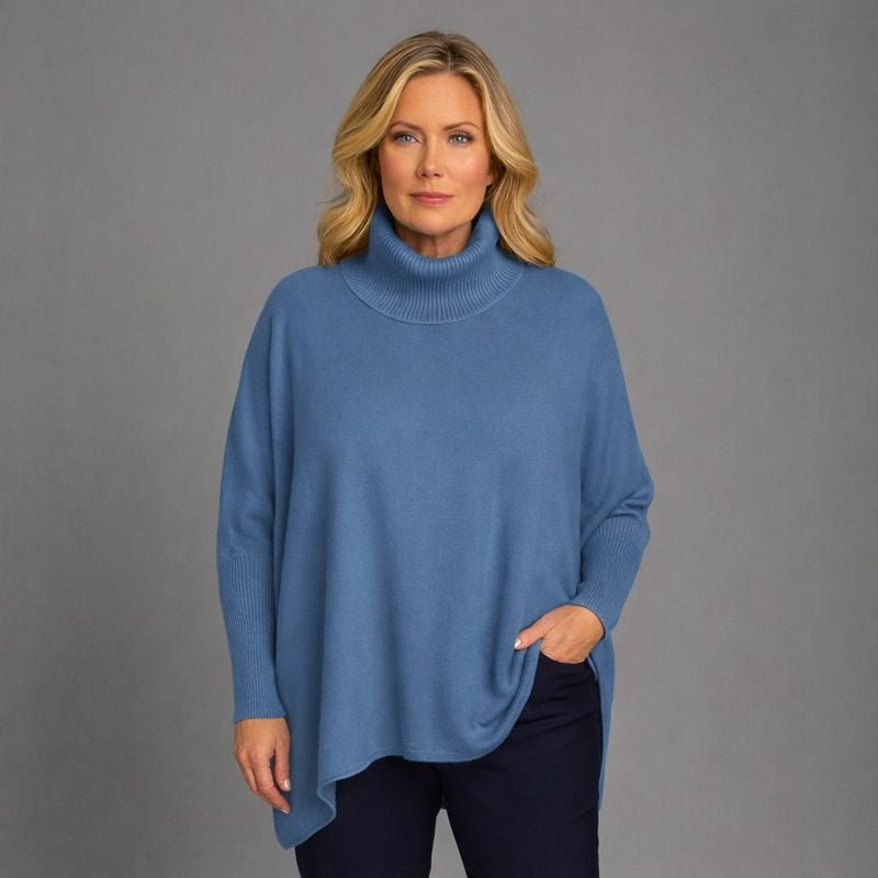 Blue Cashmere Turtleneck Sweater featuring a relaxed fit and cozy design.