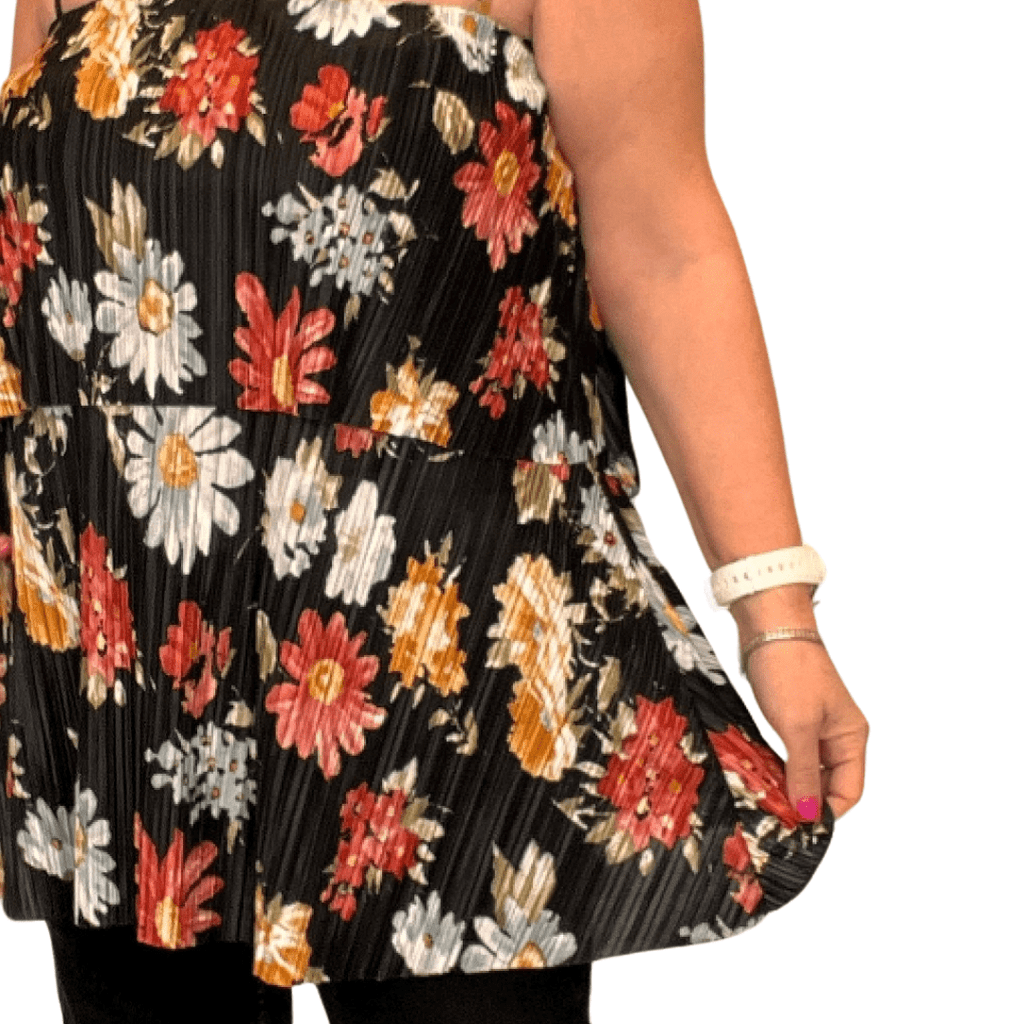 Floral Pleated Tunic featuring vibrant flowers on a black background, perfect for casual wear.