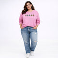 Pink Disney Mickey Mouse sweatshirt featuring colorful character designs on the front.