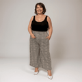 Plaid Wide-Leg Trousers featuring a relaxed fit and side pockets.
