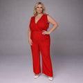 Red jumpsuit featuring a flattering v-neck and wide-leg design for a stylish look.